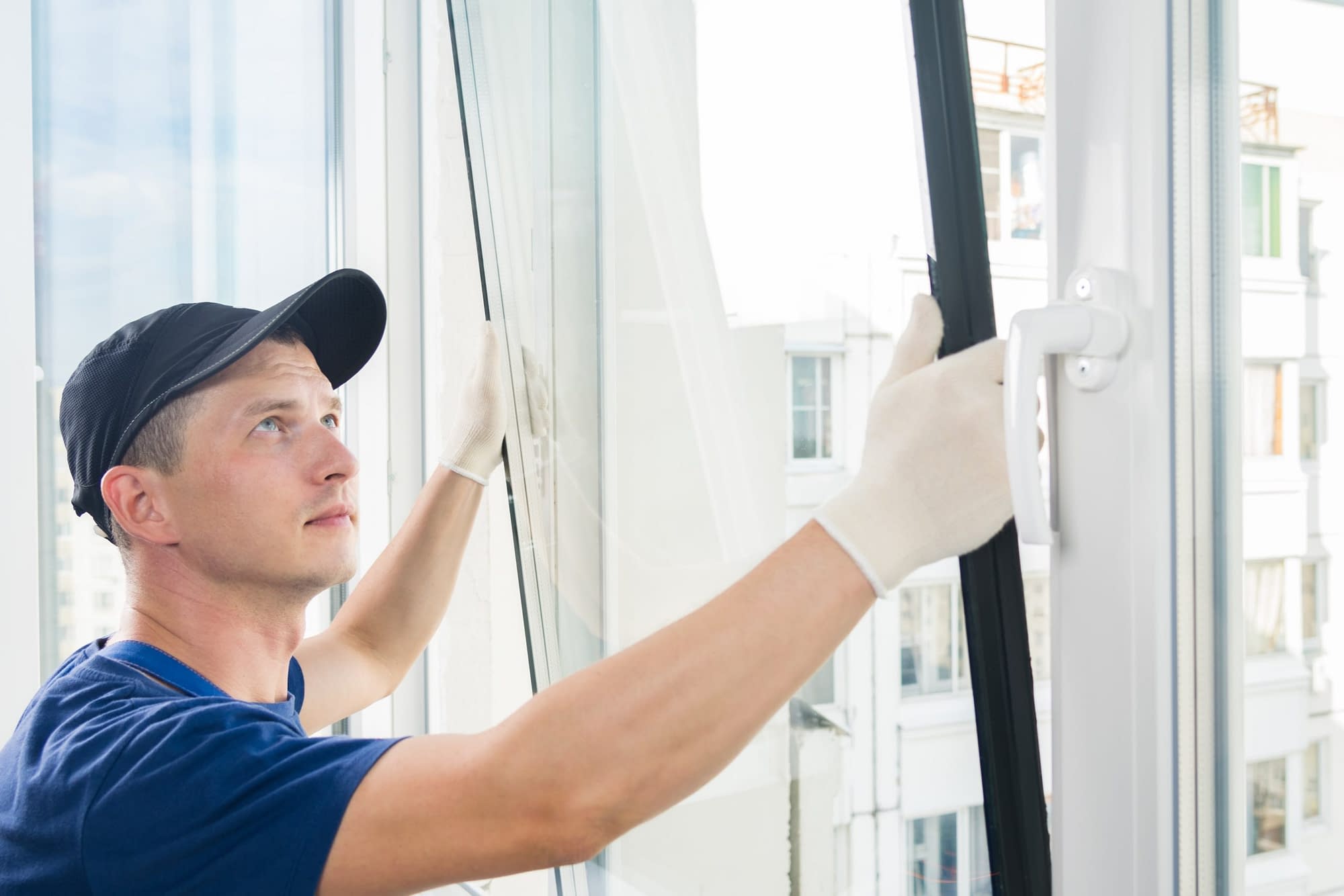 man installing new double glazed window